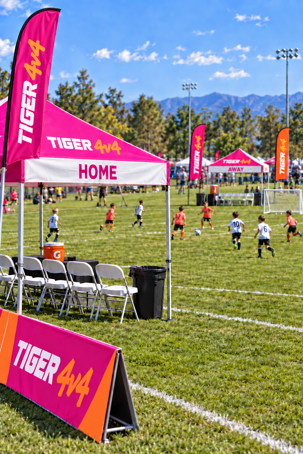 AI-generated boys 4v4 field scene with pink TIGER tents, matching flags, white chairs and young players