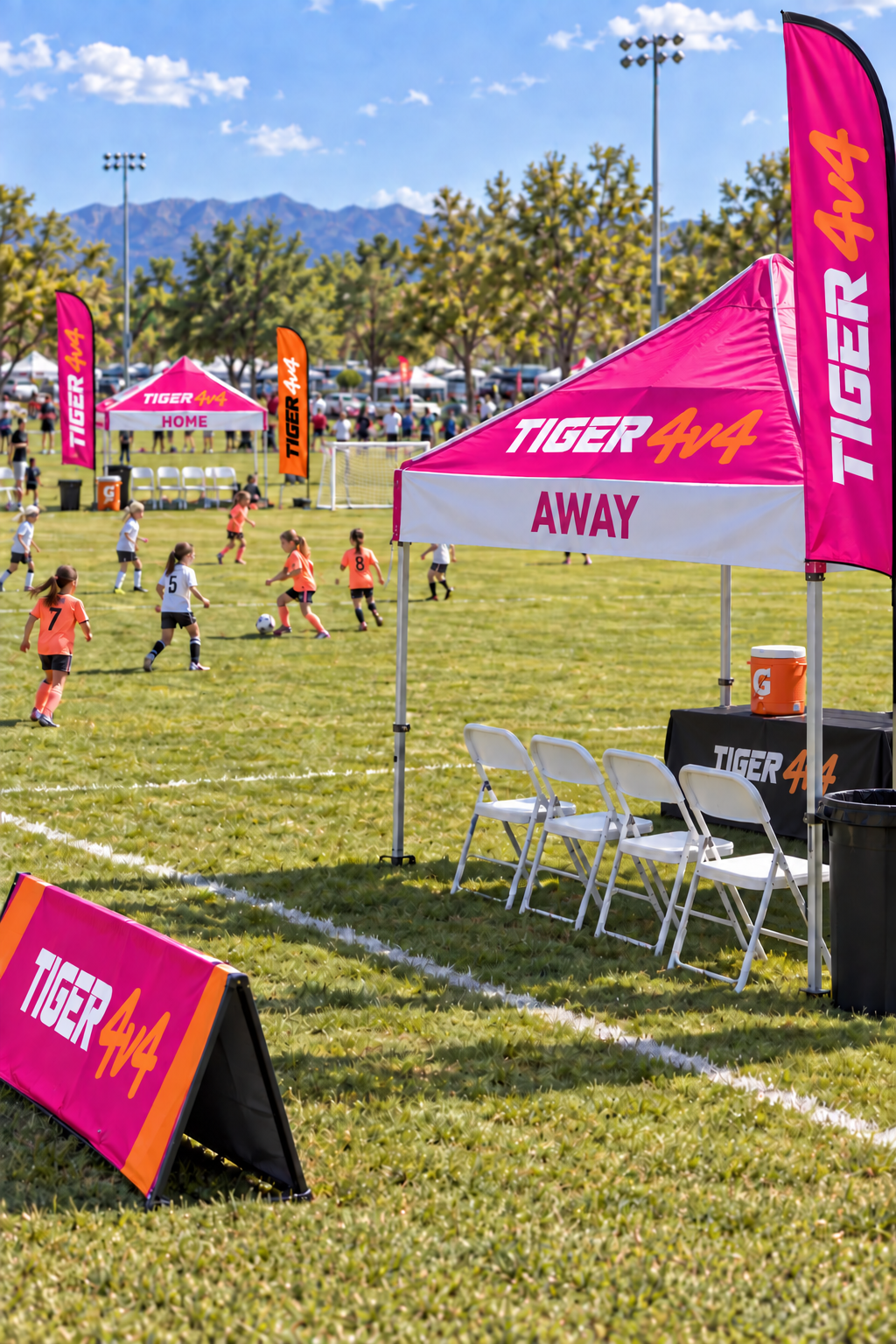 AI-generated girls 4v4 field scene with pink TIGER tents, matching flags, white chairs and young players