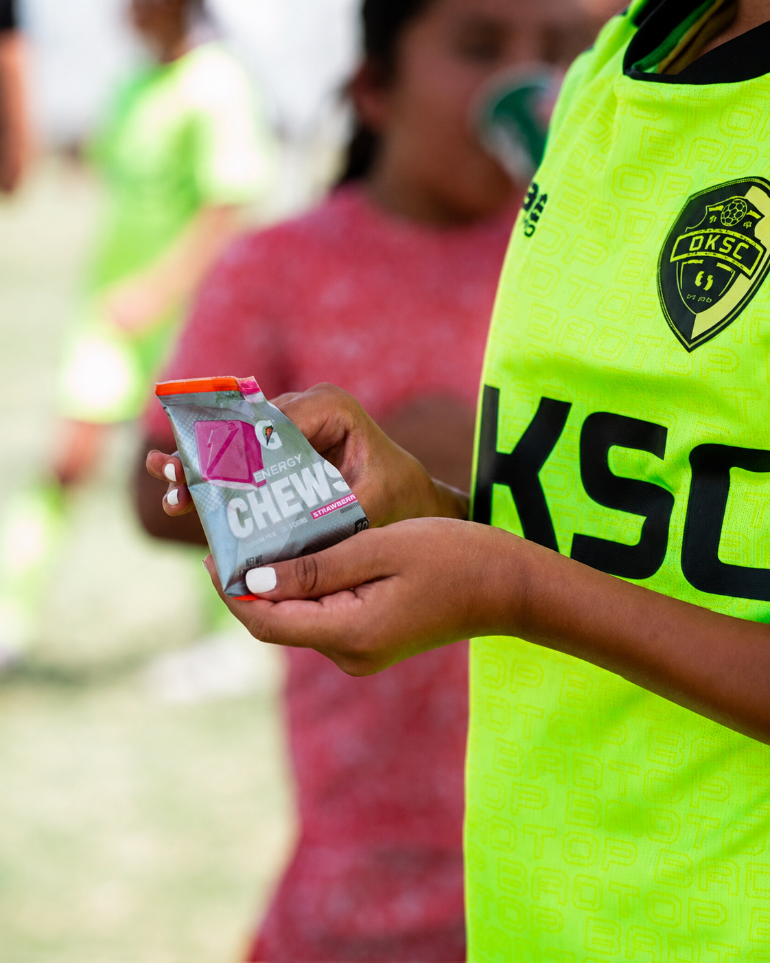 Player holding Gatorade energy chews at a Tiger tournament