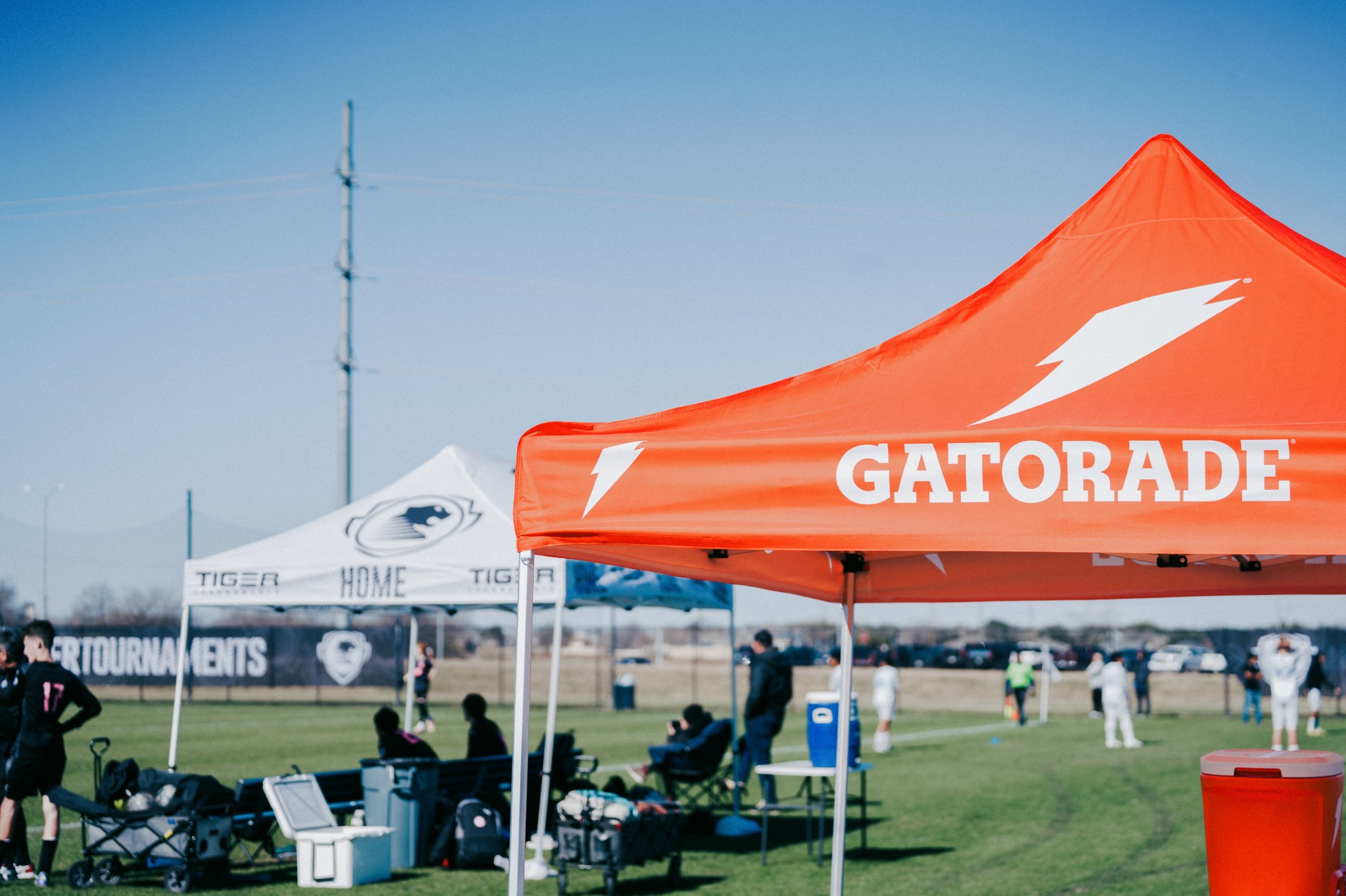Gatorade tent and orange hydration jug at a Tiger tournament